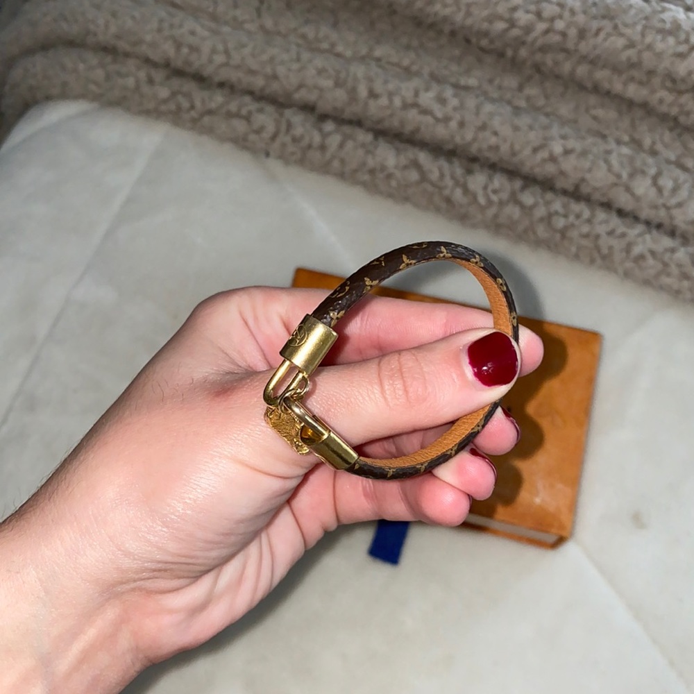 Louis Vuitton clasp bracelet with small purse gold charm